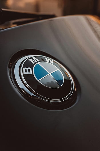 BMW emblem, black and silver, luxury car, shiny logo, close-up, modern design, car logo, BMW logo, automotive design, car branding, high-end vehicle