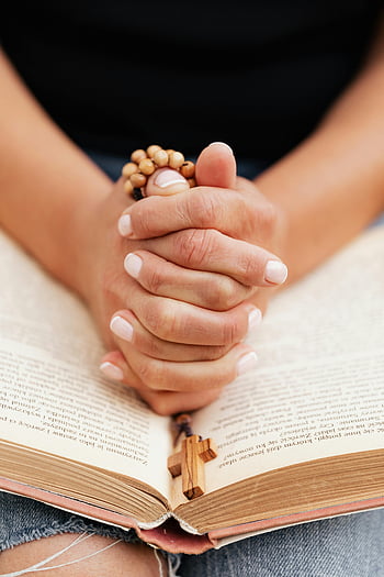 praying hands, rosary, open Bible, faith, devotion, close-up shot, religious, prayer, cross, spirituality, hands clasped