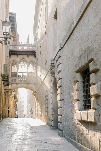 Carre del Bisbe, Barcelona, Spain, Gothic street, Bisbe Bridge, historic quarter, sunlit street, stone architecture, medieval architecture, city street, historic cityscape