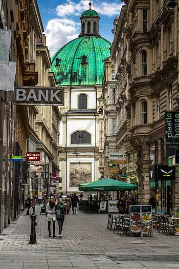 Vienna, St. Peter's Church, dome building, historic district, busy pedestrian street, green dome, cityscape, urban scene, European architecture, outdoor cafes, street life