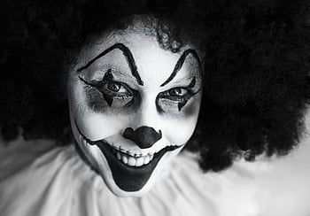 clown costume, black and white, close-up, smiling clown, face paint, Halloween themes, detailed photo, spooky clown, creepy clown, clown makeup, clown face