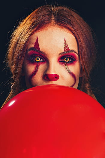 woman with face paint, clown makeup, red balloon, Halloween vibe, portrait, face paint, red nose, spooky, festive, costume, makeup