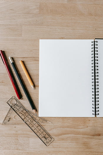 pencils, rulers, notebook, wooden desk, stationery items, educational themes, overhead view, blank notebook, school supplies, study desk, workspace setup