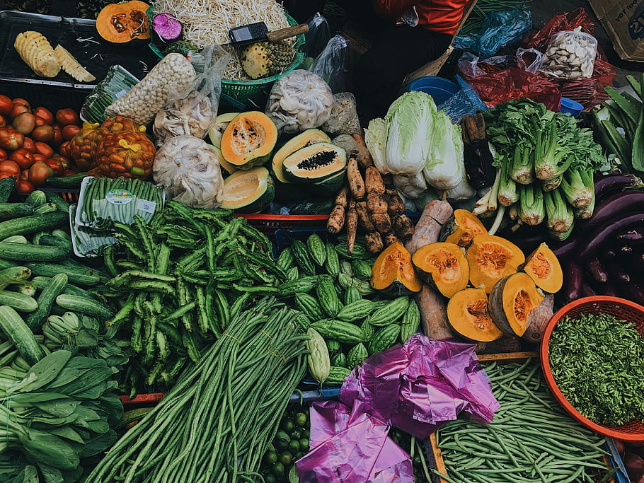 assorted vegetables, fresh vegetables, outdoor market, colorful vegetables, papaya, cucumbers, green beans, tomatoes, cabbage, carrots, eggplant