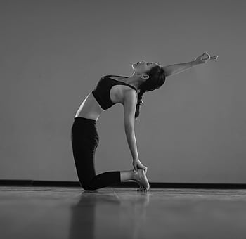 woman doing yoga, yoga pose, indoor yoga, balance and flexibility, graceful yoga, woman practicing yoga, indoor exercise, yoga indoors, yoga balance, yoga flexibility, yoga pose indoors