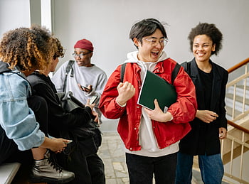 college students, diverse students, university setting, indoor interaction, friendship, staircase, group discussion, happy students, educational environment, multi-ethnic group, casual attire