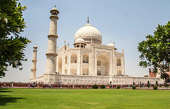 Taj Mahal, daytime, white marble, lush gardens, sunny day, iconic landmark, Agra, India, tourist attraction, historical monument, architectural marvel