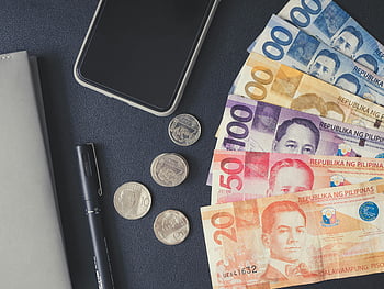 Philippine money, black surface, peso bills, coins, smartphone, notebook, financial themes, flat lay, Philippine peso, money photo, financial photo