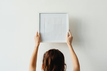woman, hanging, empty, picture frame, white wall, copy space, indoor, art, decoration, home decor, minimalist