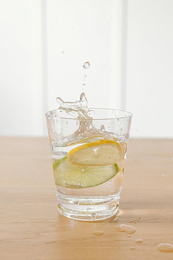 lemon slices, lime slices, glass of water, refreshing drink, healthy drink, lemon water, lime water, water splash, citrus drink, fruit infused water, lemon lime water