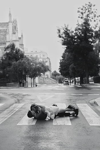 black and white, couple kissing, zebra crossing, empty street, city street, romantic scene, urban romance, street photography, black and white photography, couple in love, romantic couple