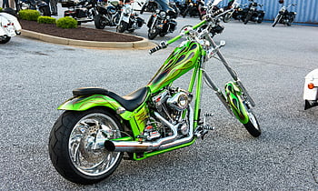 green naked chopper, motorcycle, parking lot, vibrant custom, chrome detailing, parked outdoors, green motorcycle, custom motorcycle, chrome motorcycle, outdoor motorcycle, green chopper