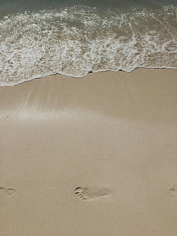footprints on sand, serene beach, gentle ocean waves, Dominican Republic beach, sandy beach, ocean waves, beach scene, footprints in sand, beach footprints, calm beach, tropical beach