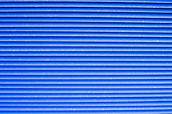 blue striped pad, vibrant blue, corrugated metal, repetitive patterns, close-up texture, blue corrugated, metal texture, striped texture, blue stripes, metal stripes, blue metal