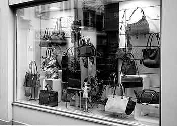 hand bag shop, luxury handbags, boutique window, black and white photo, handbag display, store window, fashion accessories, designer bags, retail display, shopping, handbags