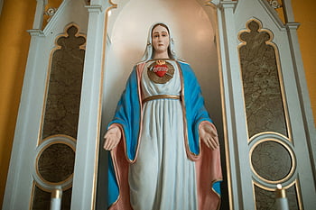 Virgin Mary, figurine, statue, sacred heart, church setting, devotion, religious art, Catholic icon, Marian statue, religious symbol, church decor