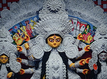 Maa Durga, Durga Puja festival, Goddess Durga, Kolkata, intricate idol, vibrant festival, close-up photo, Indian festival, religious idol, cultural celebration, traditional art