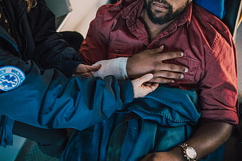 paramedic, assisting, injured patient, arm bandaged, emergency scenario, chest, medical assistance, first aid, rescue worker, healthcare professional, accident response