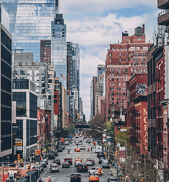 NYC street, high-rise buildings, busy traffic, bustling street scene, iconic skyscrapers, urban landscape, cityscape, New York City, street view, traffic jam, modern architecture