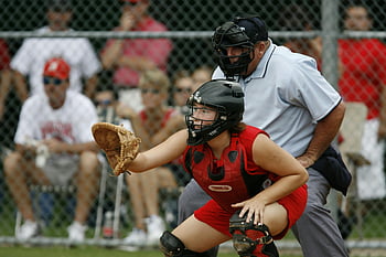 female catcher, baseball game, catcher in action, focus and athleticism, catcher position, sports photography, baseball catcher, female athlete, sports action, baseball field, umpire behind catcher