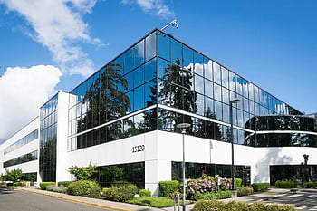 White 15120 Building, contemporary office building, Redmond, reflective glass, lush greenery, sunny day, modern architecture, corporate building, exterior view, business center, urban landscape