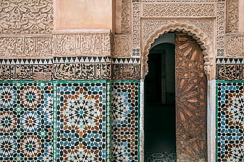 Moroccan architecture, ornate carvings, colorful geometric tiles, traditional Moroccan, Arabic ornament, old building facade, town architecture, decorative tiles, Islamic art, historic building, cultural heritage