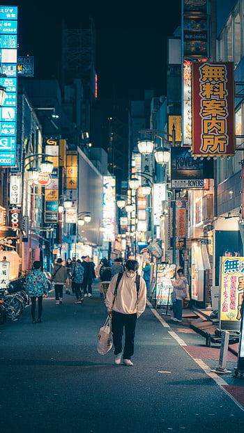 neon lights, city at night, Shinjuku City, Tokyo, busy street, pedestrians, night scene, urban nightlife, neon signs, street photography, Japan