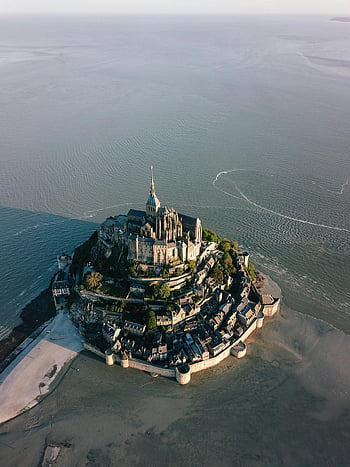 aerial view, Mont Saint Michel, historic architecture, low tide, sea, castle, France, drone photography, coastal landmark, medieval fortress, stunning view