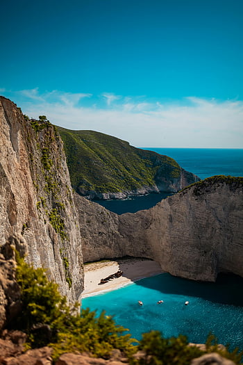 plage de navagio, île de Zakynthos, Grèce, falaises, eaux claires, baie, bord de mer, falaises à couper le souffle, plage naufrage, eau turquoise, côte rocheuse