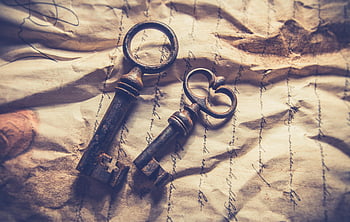 vintage iron keys, crumpled handwritten paper, rustic texture, antique keys, old paper, skeleton keys, vintage keys, handwritten document, rustic background, antique objects, vintage objects