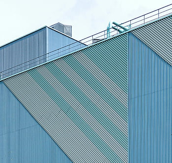 Blue Building, modern industrial building, exterior, geometric metal panels, patterns, close-up, architectural design, industrial architecture, metal facade, building exterior, contemporary design