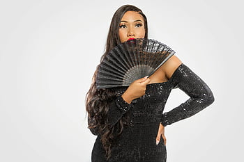 woman in black dress, black hand fan, glamorous woman, black sequined dress, fashion portrait, black long sleeve dress, elegant woman, stylish woman, black fan, fashion photo, woman with fan
