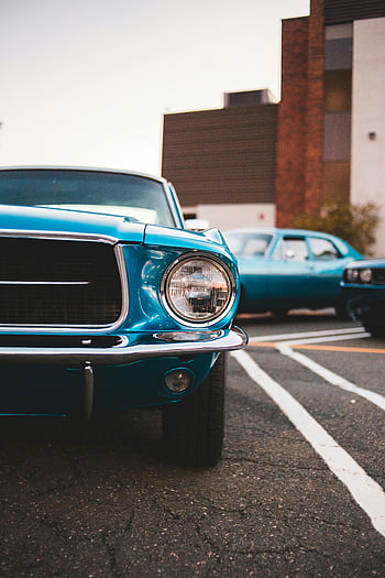 blue vintage Mustang, headlight, classic car, urban setting, daylight, front view, blue car, vintage car, Mustang, classic Mustang, urban car
