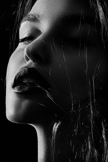 woman's face, black and white, close-up portrait, dramatic lighting, Kyiv, monochrome, female face, high contrast, artistic photography, black and white photography, Kyiv portrait