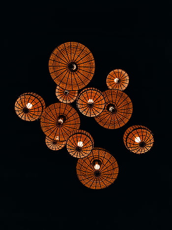 traditional paper lanterns, lighted paper lanterns, warm glow, dark background, traditional lanterns, paper lanterns, lantern display, decorative lanterns, hanging lanterns, night lighting, ambient lighting