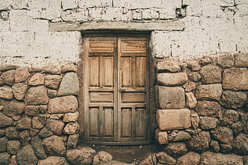 closed brown wooden door, rustic wooden door, stone wall, vintage architectural style, old door, wooden door, stone wall door, rustic architecture, vintage door, old wooden door, rustic style