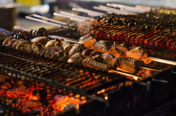 grilled meat, charcoal grill, juicy kebabs, open flames, barbecue, summer cookouts, grilling, skewers, outdoor cooking, barbeque, flames