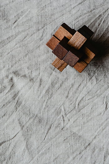 brown wooden blocks, gray textile, minimalist wooden game, textured background, wooden puzzle, brain game, wooden blocks puzzle, gray fabric, wooden toy, minimalist design, textured textile