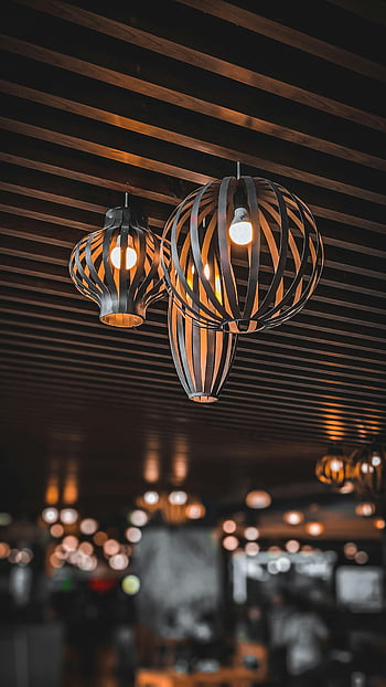 ceiling lamps, warm ambiance, modern lighting, blurred background, indoor lighting, decorative lamps, ambient lighting, interior design, modern decor, warm light, ceiling fixtures