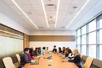 conference room, multicultural team, brainstorming, collaborating, business meeting, group of people, meeting room, professional setting, team discussion, office environment, diverse team