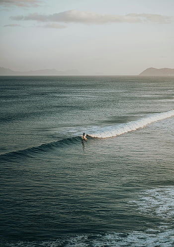 aerial-shot-person-surfing-ocean-waves-s