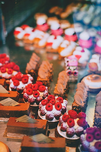 delicious desserts, confectionery shop, assorted pastries, raspberry desserts, chocolate desserts, tempting treats, bakery display, sweet treats, dessert assortment, raspberry pastries, chocolate pastries