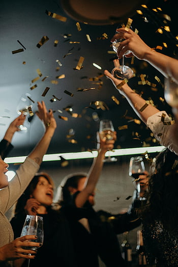 New Year's Eve, party, champagne, confetti, celebration, indoor, festive, people, enjoying, lively, drinks