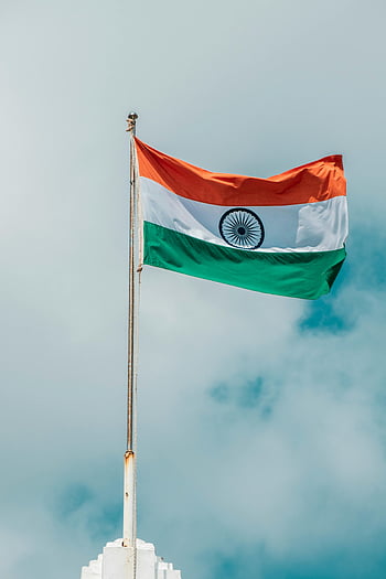 Indian flag, white clouds, cloudy blue sky, Puducherry, national flag, waving flag, Indian national flag, flag pole, sky background, patriotic scene, Indian tricolor