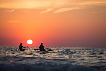 sunset, paddleboarding, ocean, couple, silhouette, golden hour, sea, adventure, romance, boat rowing, evening