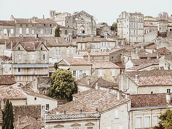 Bordeaux, historic architecture, old town rooftops, vintage facades, brown concrete buildings, French charm, European cityscape, urban heritage, traditional buildings, architectural beauty, historic town