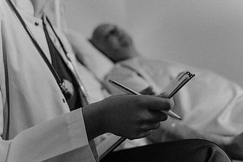 doctor, medical chart, patient, hospital setting, taking notes, consultation, healthcare professional, medical examination, patient care, healthcare, medical consultation