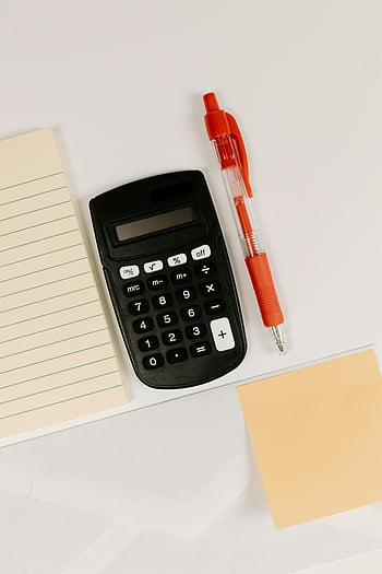 black calculator, ball pen, red pen, paper, white surface, copy space, office supplies, desk items, stationery, financial tools, calculation tools