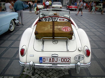white classic MG car, vintage 1956 MG, convertible, luggage, outdoor car show, rear view, classic car, vintage car, MG logo, car show, luggage rack