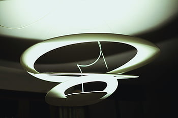modern chandelier, abstract lighting, circular rings, futuristic design, white drop-ceiling, contemporary light fixture, indoor lighting, unique chandelier, minimalist design, ceiling light, modern home decor